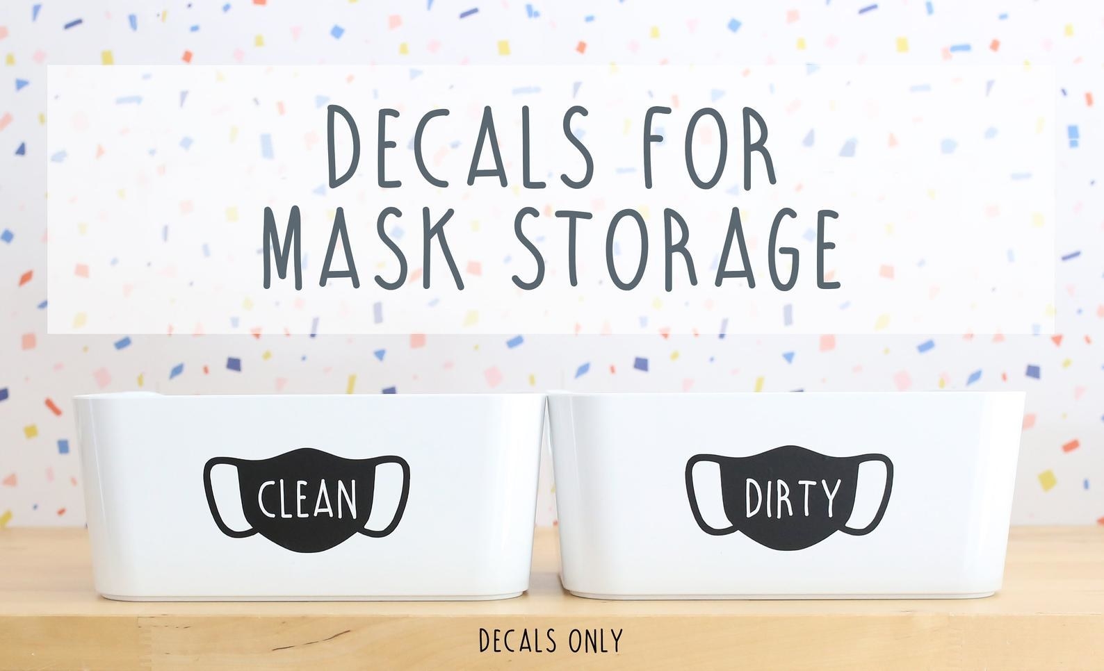 two black mask-shaped decals, one that says &quot;clean,&quot; the other &quot;dirty&quot; 