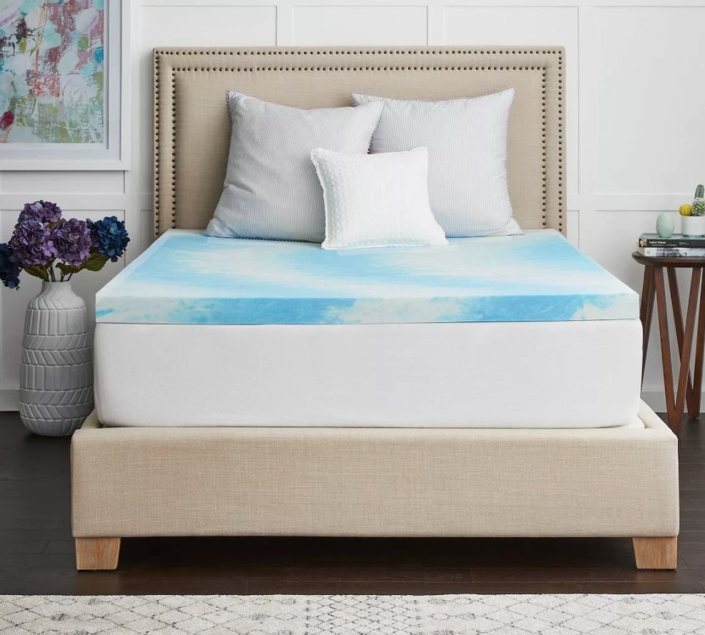 The blue and white cloud-shaped mattress pad