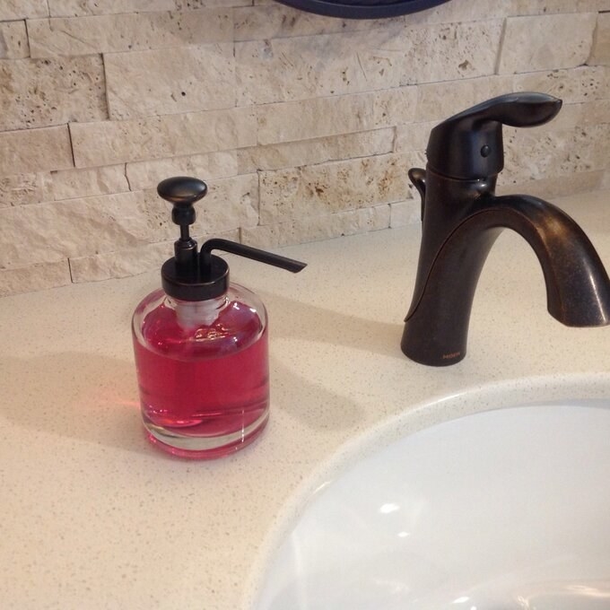 Reviewer&#x27;s photo of the glass soap dispenser 