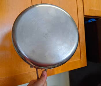 The pan restored to spotless, shiny silver