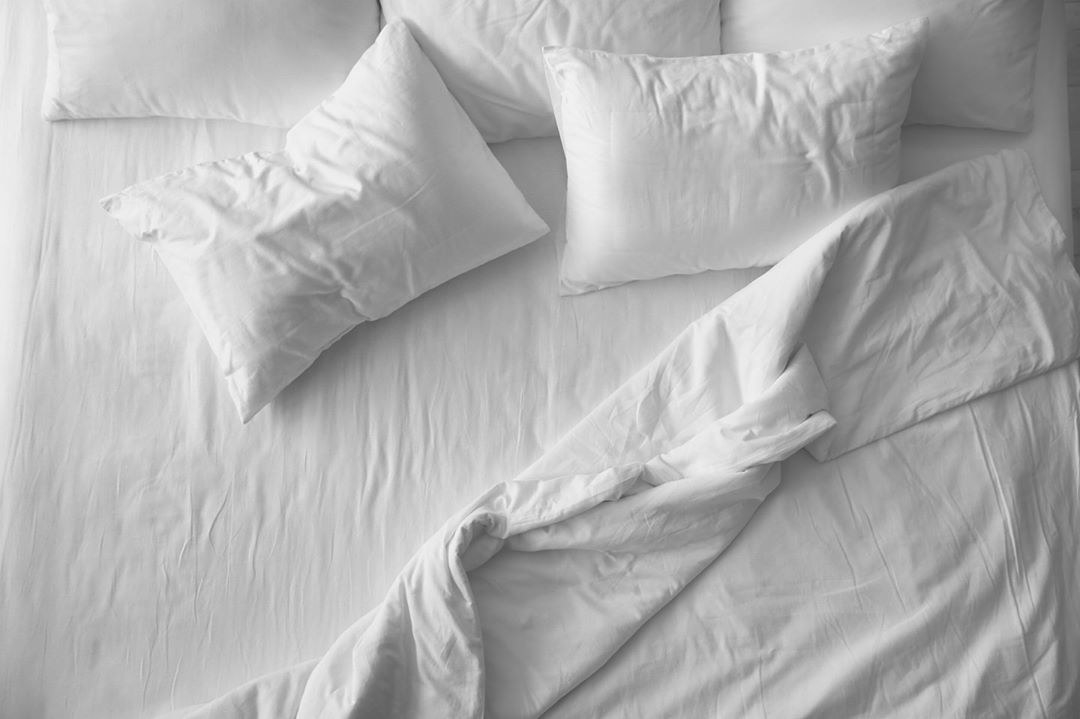 crisp white sheets on a bed