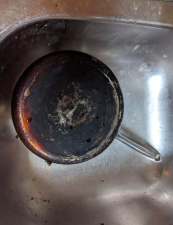 A reviewer's pan black with caked on grease