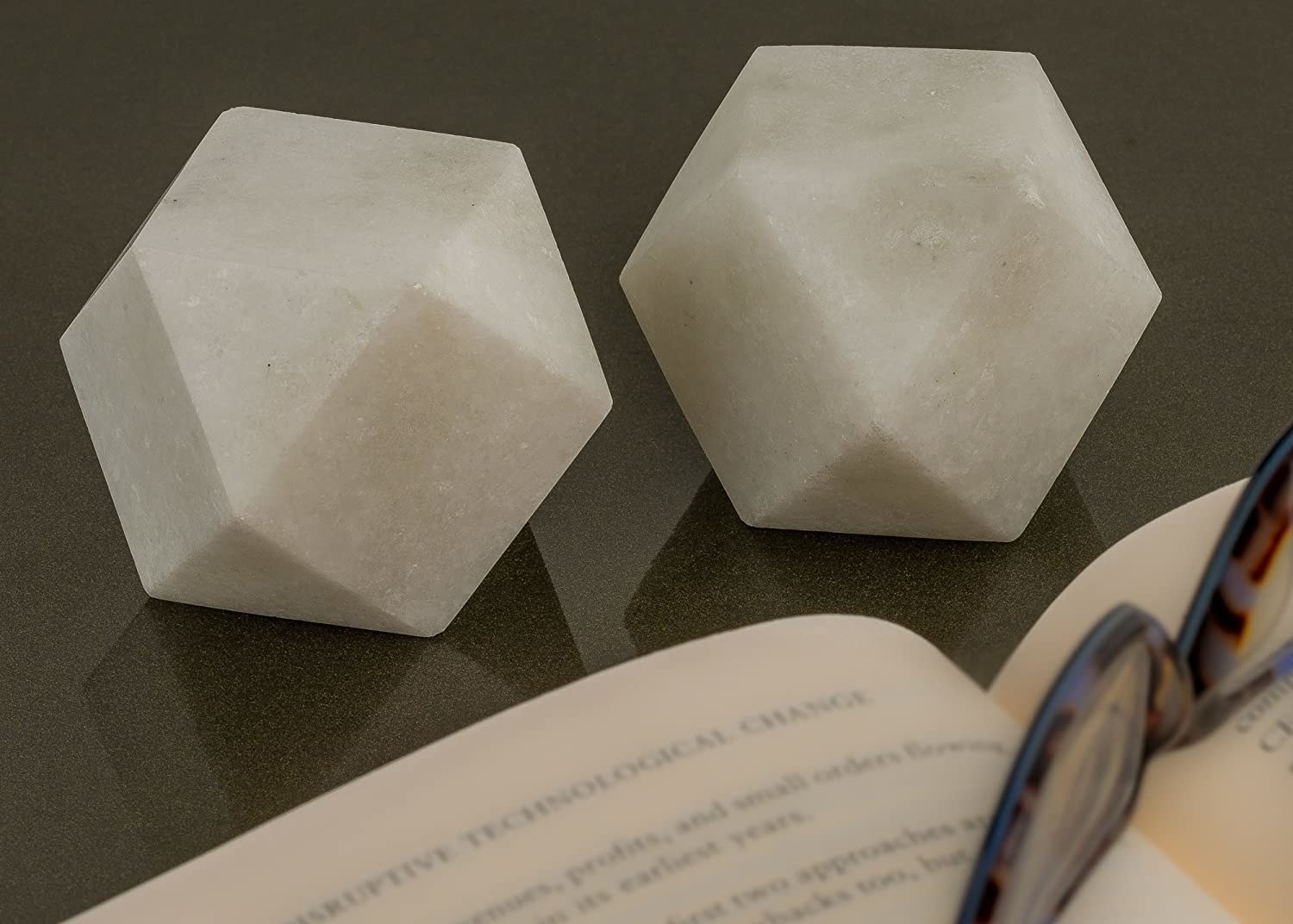 2 marble paperweights in a geometric design.