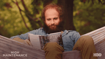 The Guy from  &quot;High Maintenance&quot; sitting in a hammock reading a book