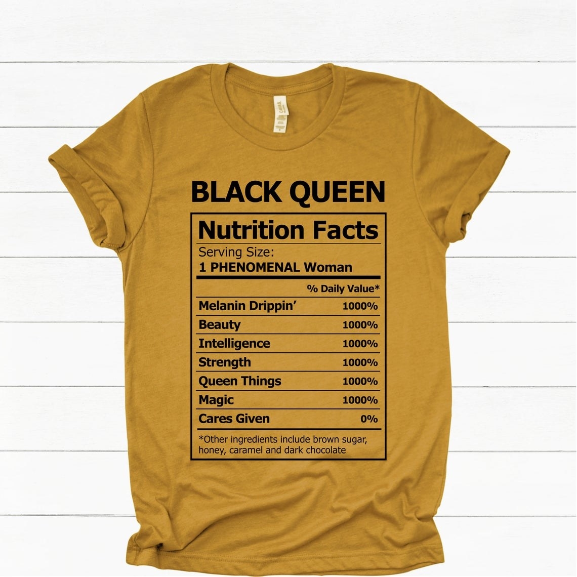 Mustard tee with the words &quot;Black Queen&quot; and &quot;Nutrition Facts&quot; with several strengths listed in the style of an ingredient list