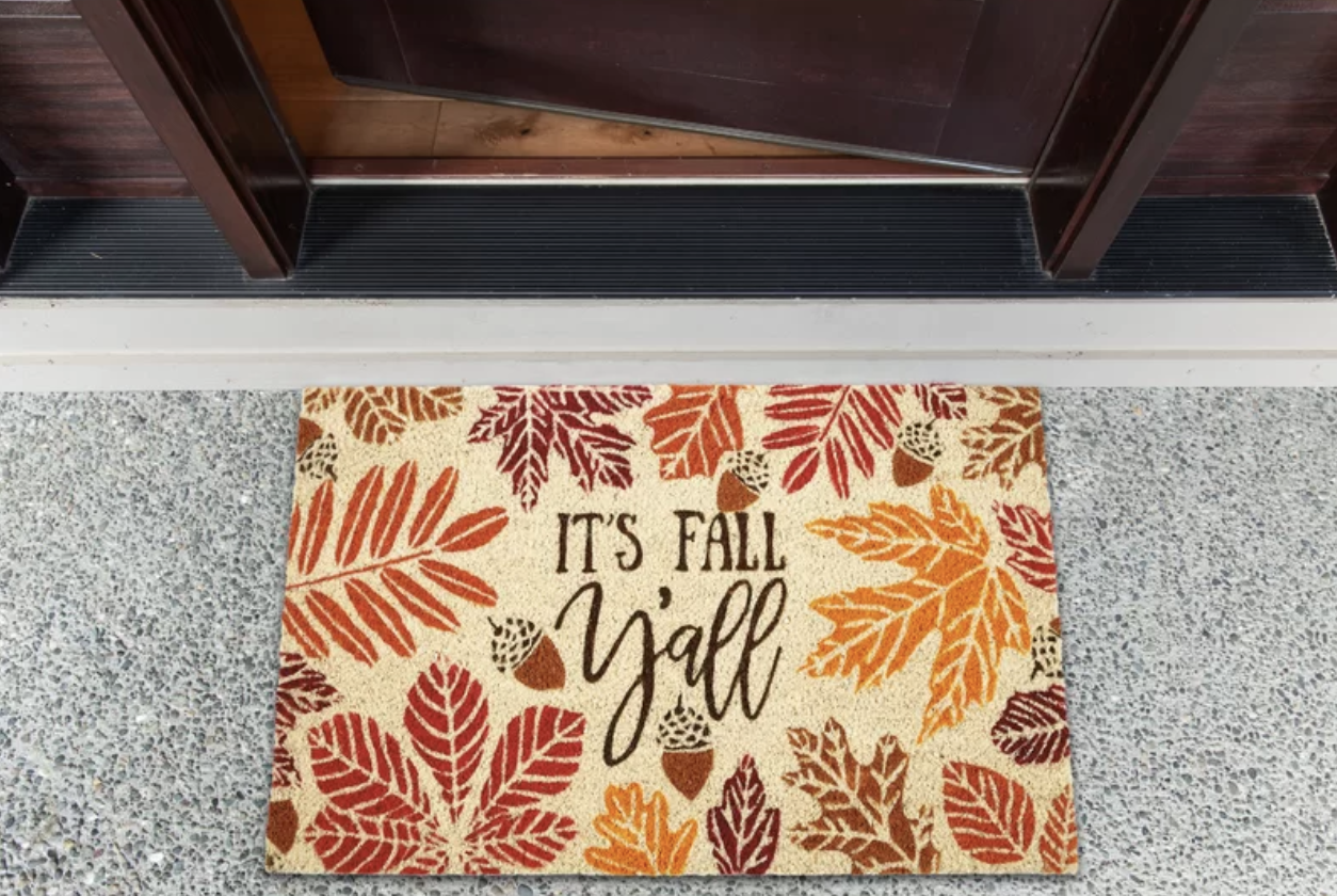 The light tan doormat featuring colorful leaves and acorns 