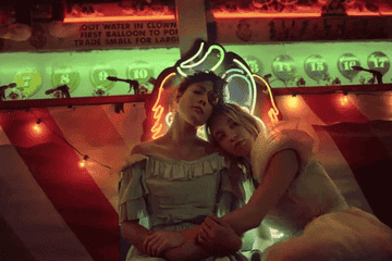A GIF of Halsey and Sydney Sweeney in the &quot;Graveyard&quot; music video