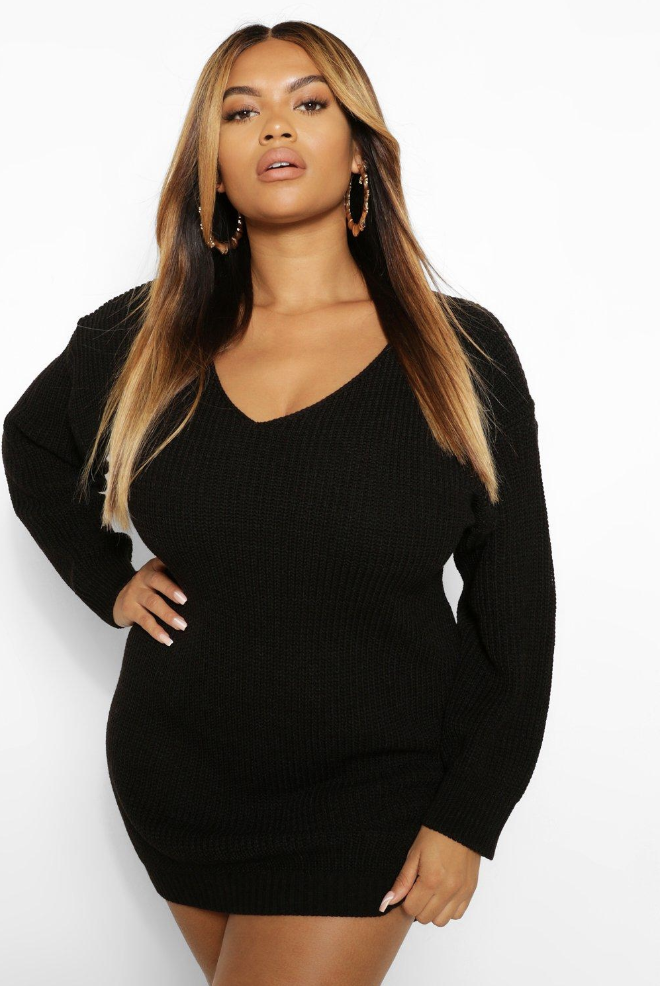 Model in a long-sleeved black jumper dress 