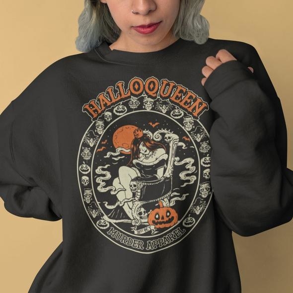 model wearing black sweatshirt that says Halloqueen on it with a jack o lantern design