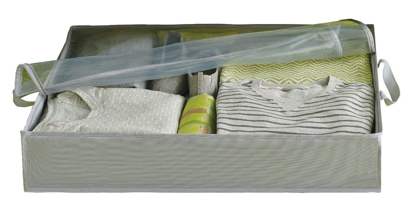 Gray storage box with clothes inside