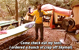A gif of Tom Haverford from the show Parks and Recreation walking into a tent while saying, &quot;Come check out my tent. I ordered a bunch of crap off Skymall.&quot; 