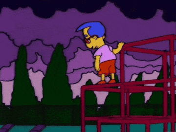Milhouse stands alone, sad, troubled. 