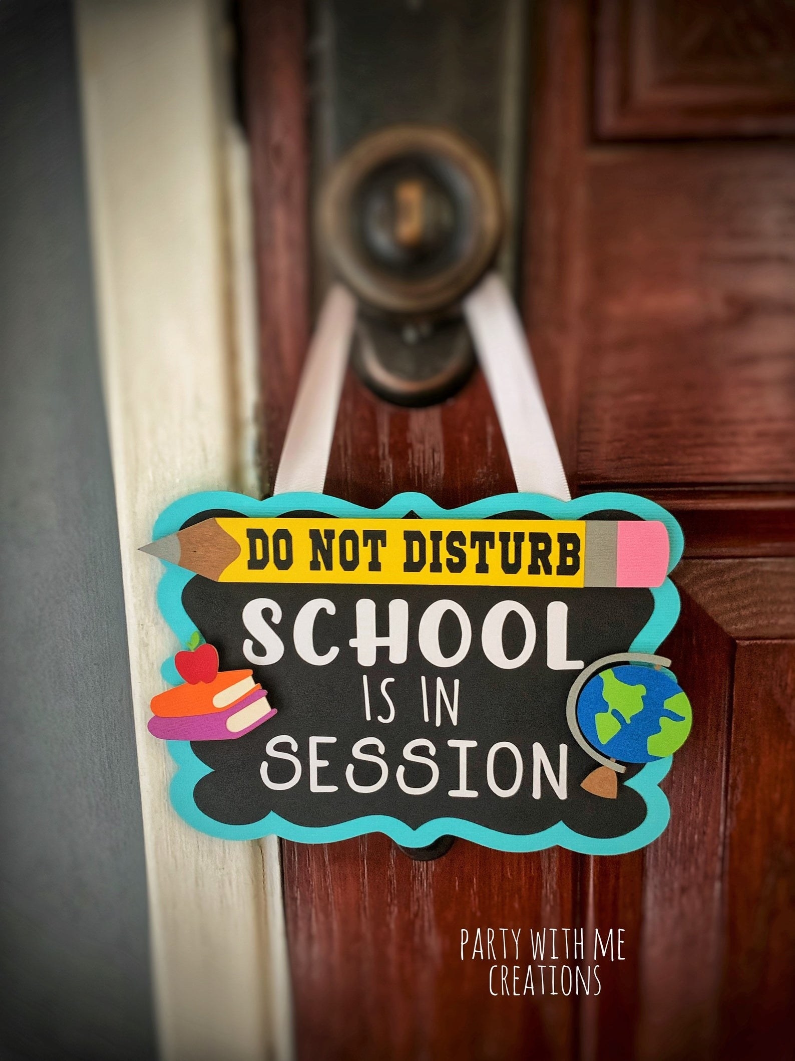 a wooden sign hanging on a doorknob that says &quot;do not disturb&quot; inside of a pencil graphic and &quot;school is in session&quot; underneath it