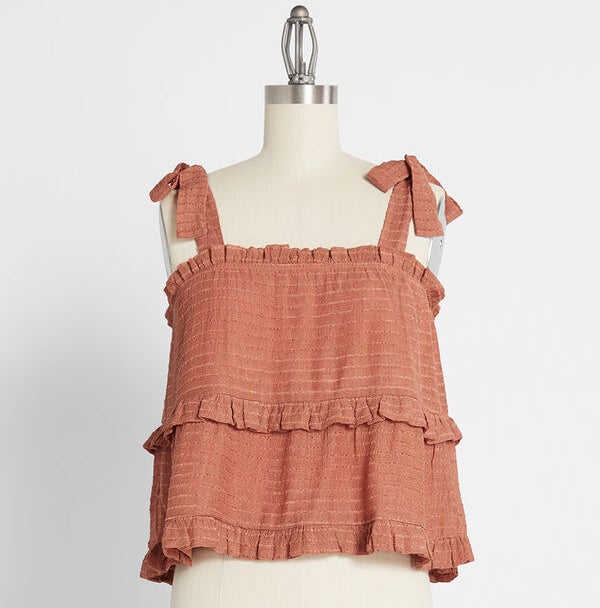 The "rust" colored tiered tank top on a mannequin