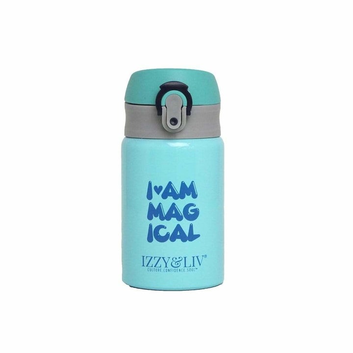 a short tumbler cup that's light blue. The "I am magical" words are in royal blue.