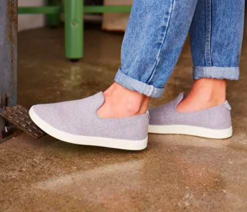 A person wears a pair of wool loungers