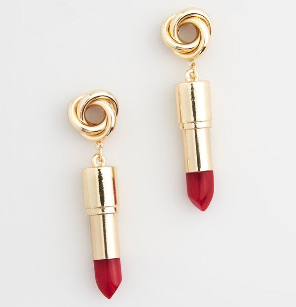 The gold earrings with the red lipstick design