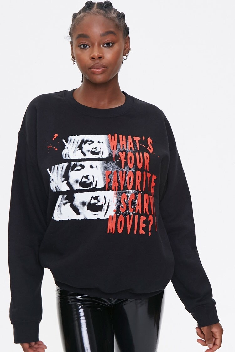 Crew neck sweatshirt in black with images of a woman screaming and the words "What's Your Favorite Scary Movie?" written in red