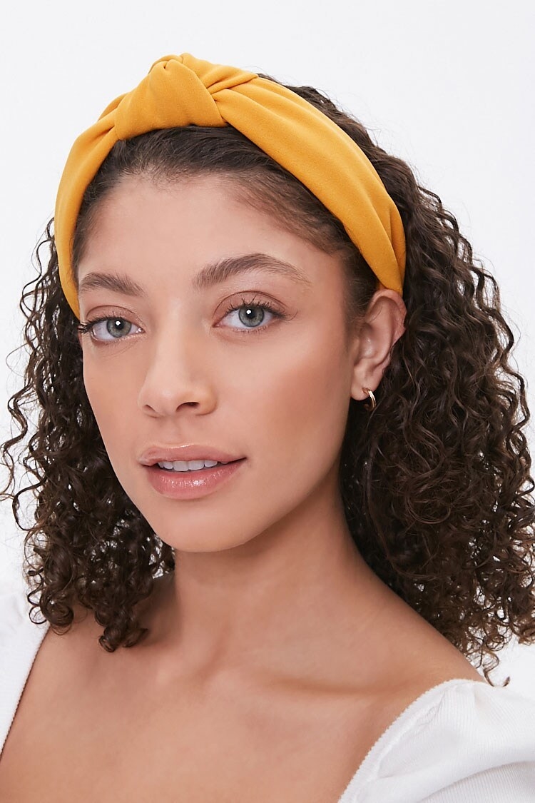 The headband with a knot at the top in yellow