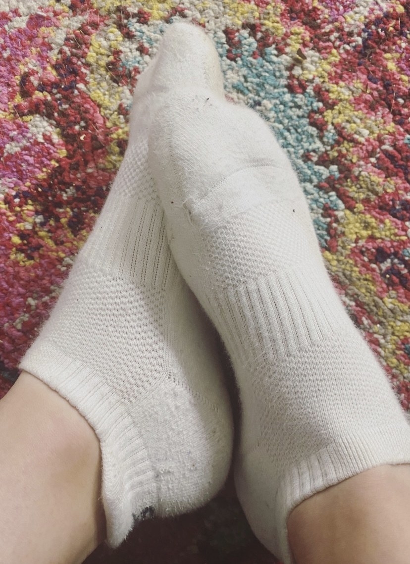 BuzzFeed editor in a pair of white socks with a lip at the ankle 