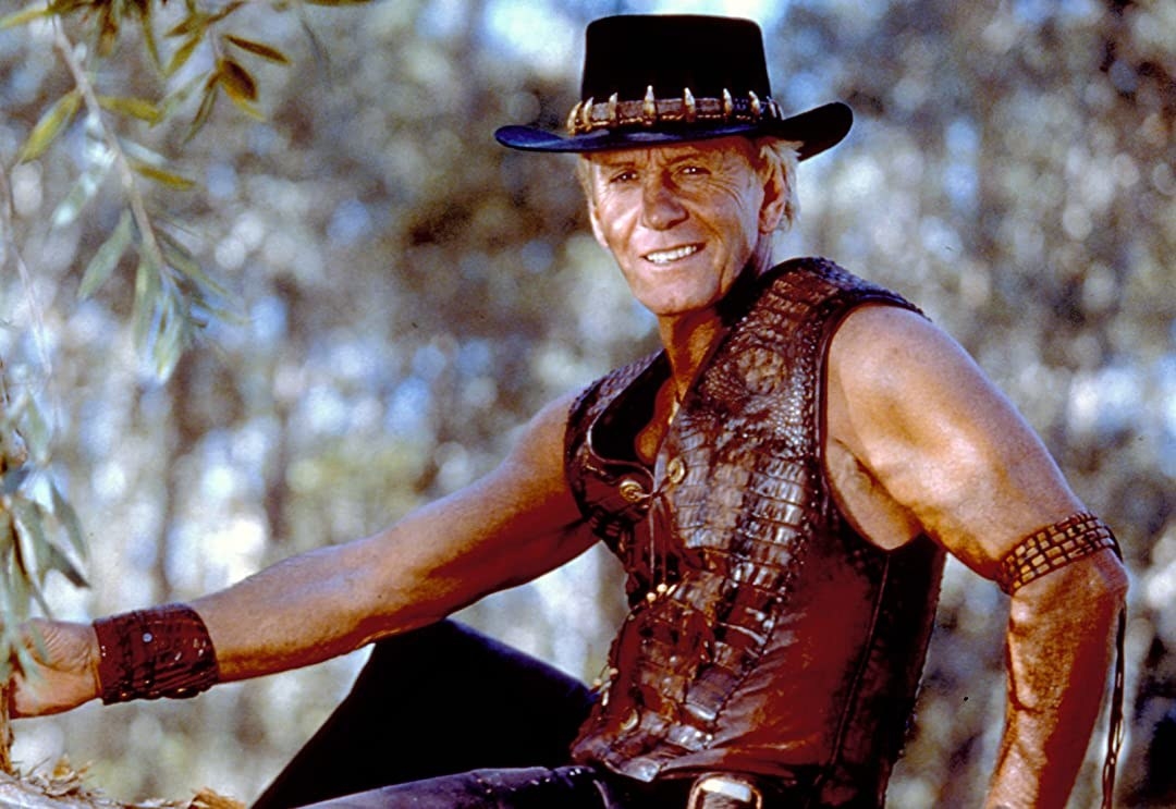 Paul Hogan from &quot;Crocodile Dundee&quot; sitting down 