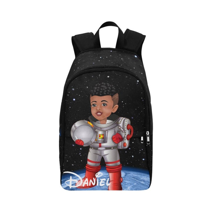 backpack with a young boy dressed like an astronaut standing on the moon with helmet in hand. He has a fade haircut and light brown skin.