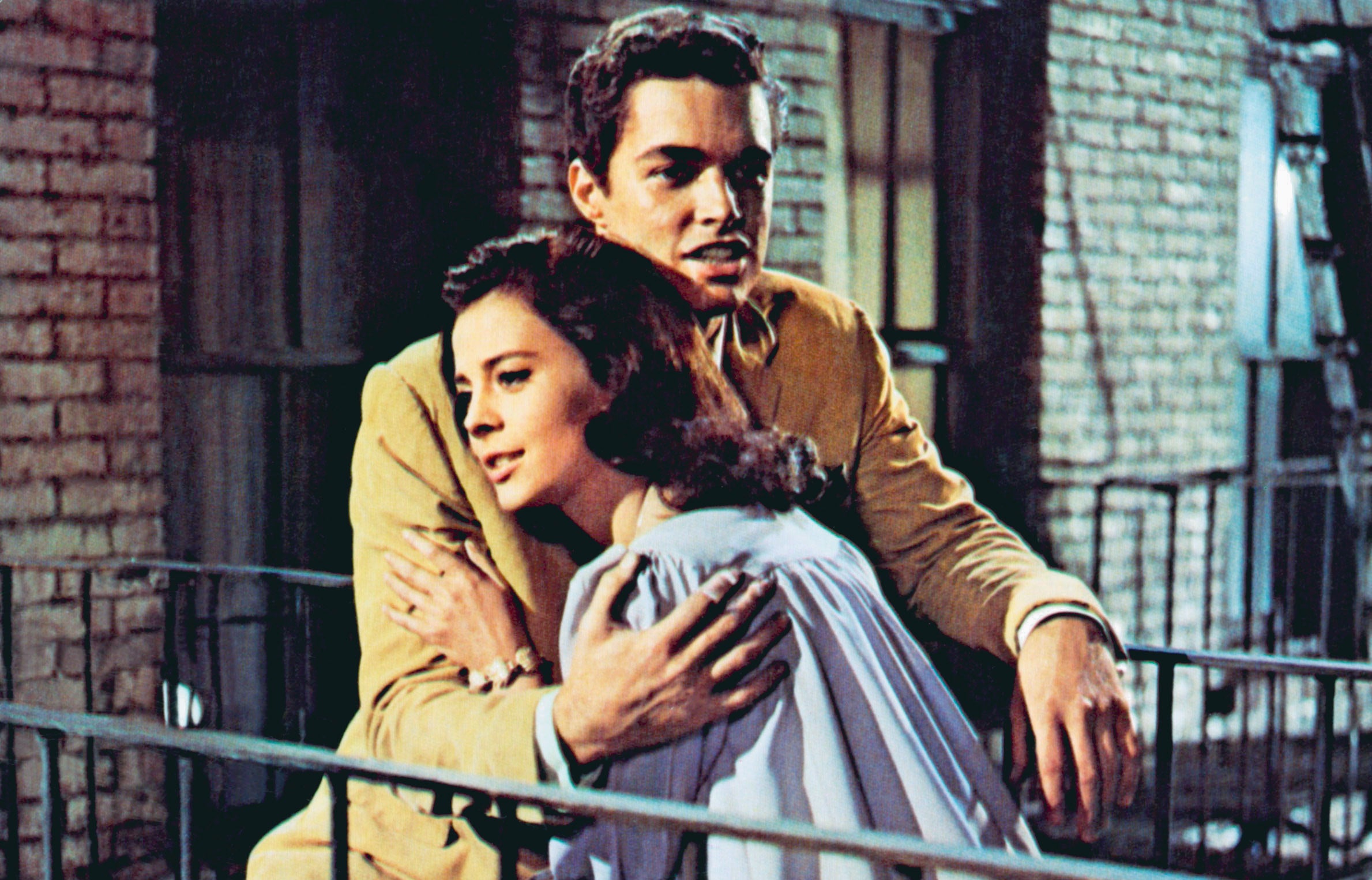 Natalie Wood as Maria in West Side Story hugging Tony. 