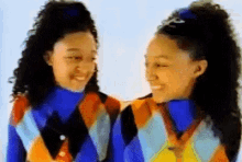 GIF of Tia and Tamera Mowry pointing to each other