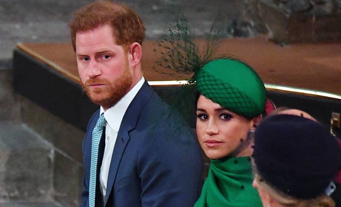 Prince Harry and Meghan Markle look sad during an event