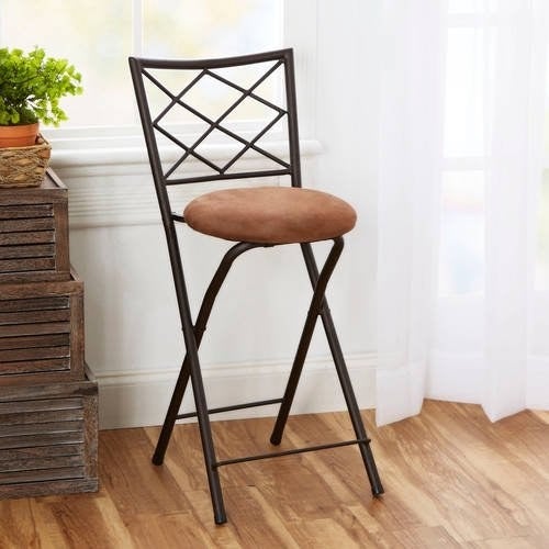 X-back folding stool in tan