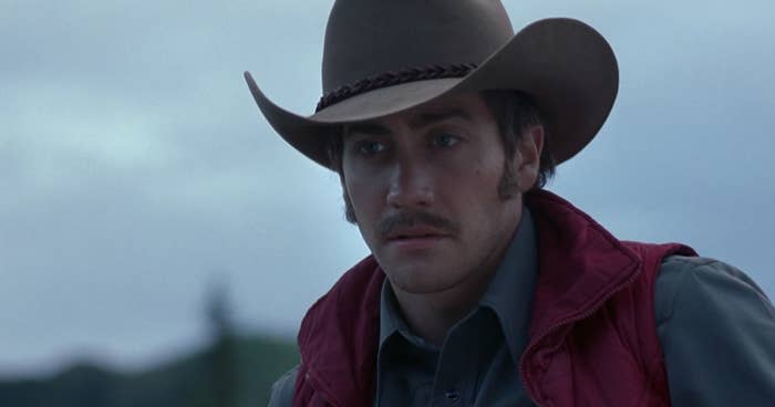 A cowboy played by Jake Gyllenhaal wearing a cowboy hat
