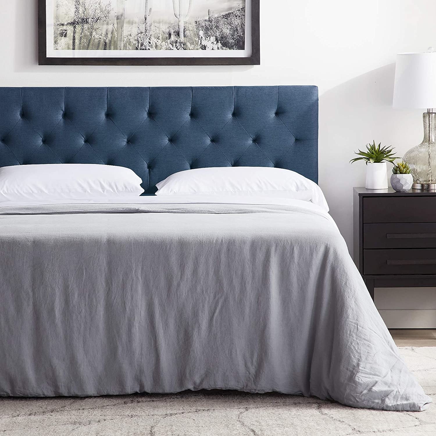 The tufted headboard in cobalt blue