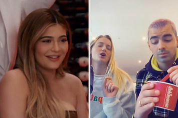 Kylie Jenner in the original E! clip next to Sophie Turner and Joe Jonas covering the audio