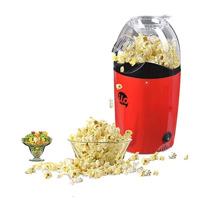 Red popcorn maker with a transparent lid.