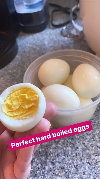 Samantha Wieder showing the inside of a perfectly cooked hard boiled egg