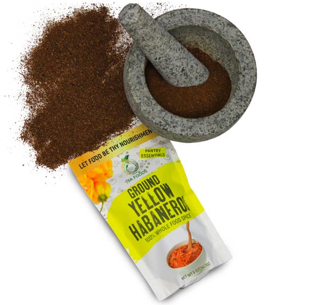 The packet of ground yellow habanero with the ground spice, which is dark brown