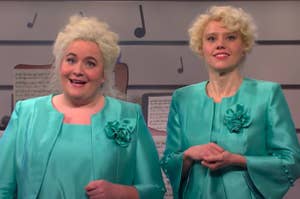 Aidy Bryant and Kate McKinnon dressed as elderly show choir directors