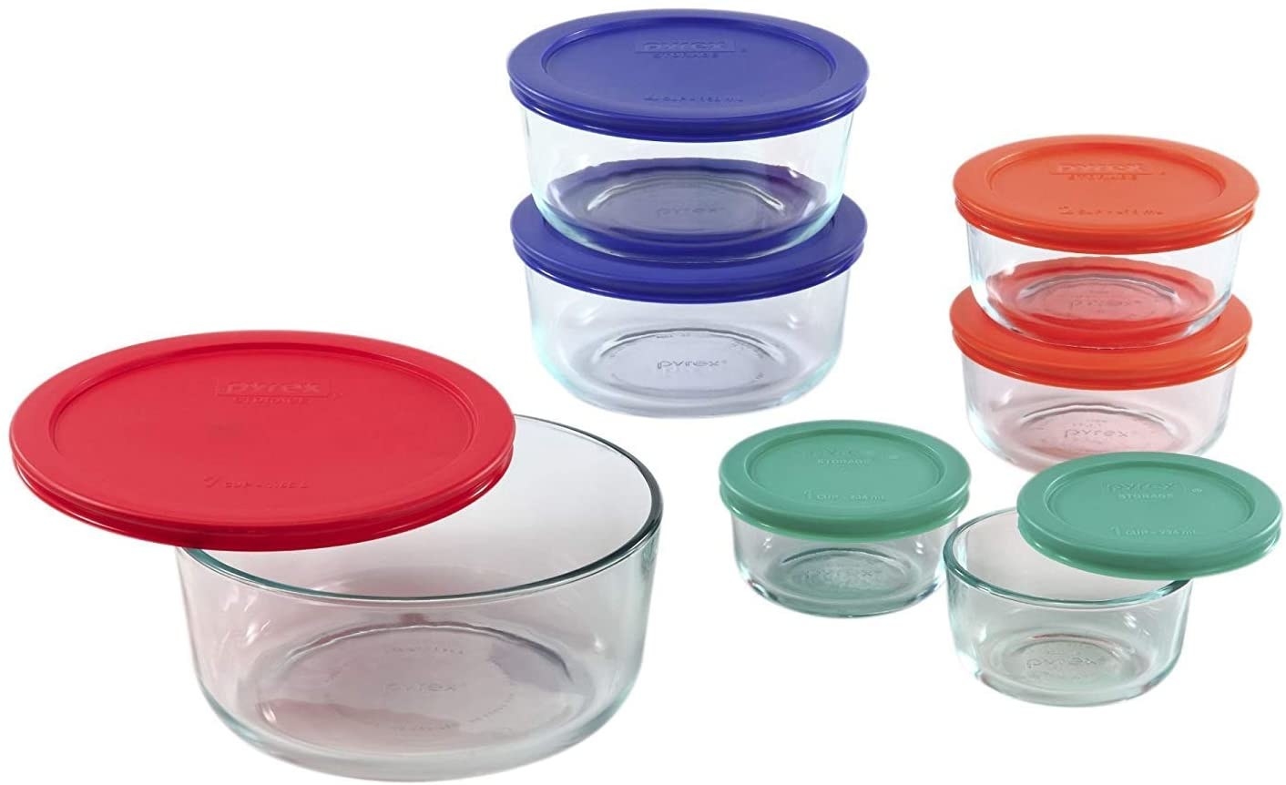 Different sized, round glass containers with different coloured lids. 