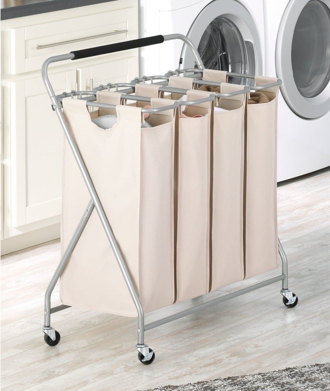 The sorter, which was four beige bags, hanging by velcro from the metal, wheeled frame, which has a padded handle