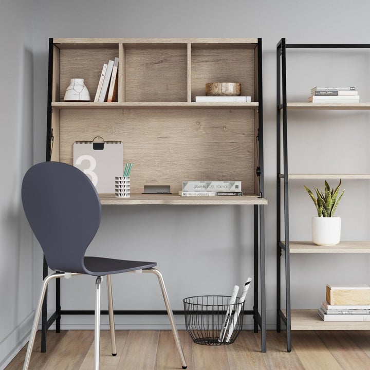 The desk in the open position, with three cubby shelves along the top, and a large fold-out desk top