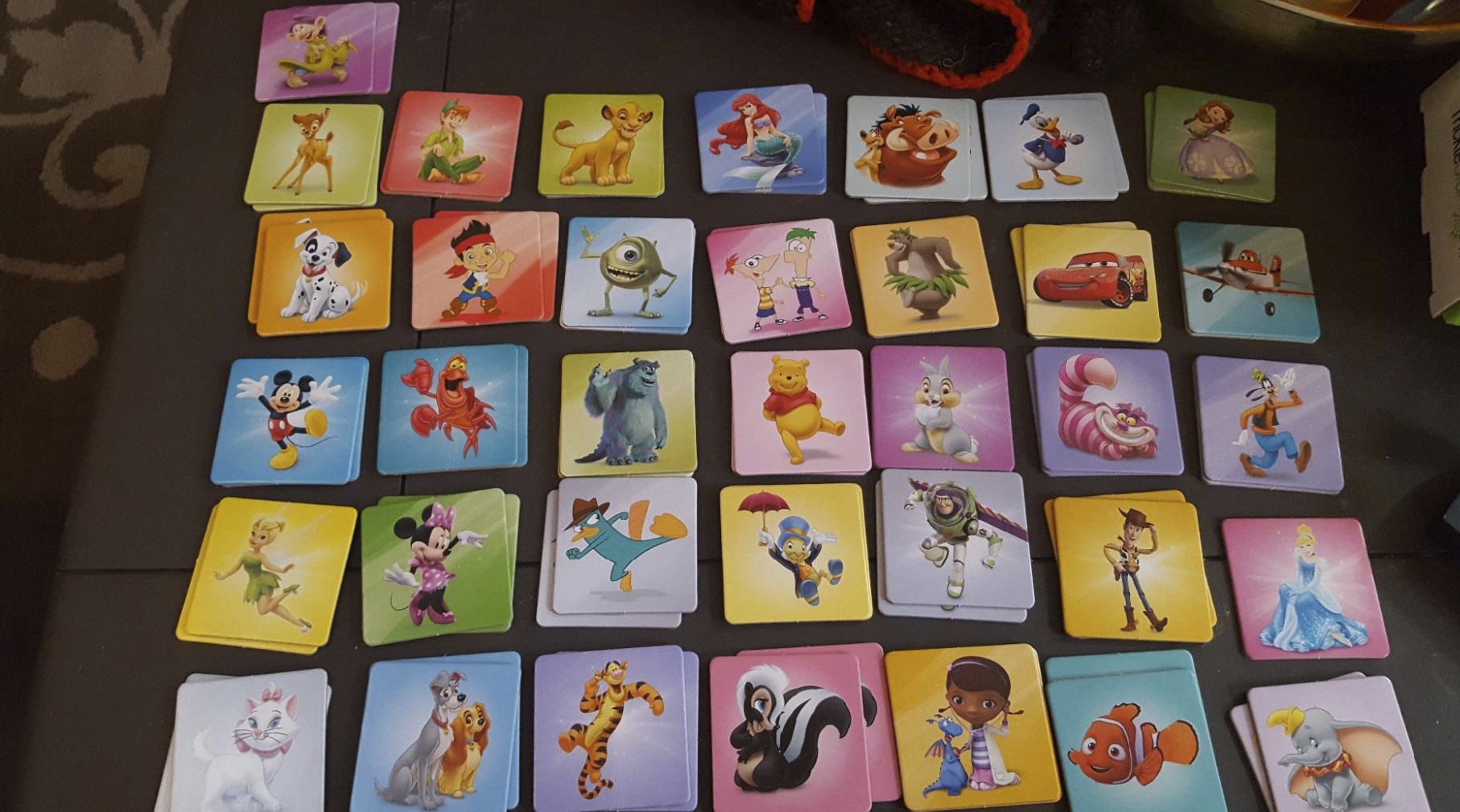 cards laid out with Disney and Pixar/Disney characters. Three examples here are Nemo from &quot;Finding Nemo,&quot; Simba from &quot;The Lion King,&quot; and Phineas and Ferb from the namesake show.