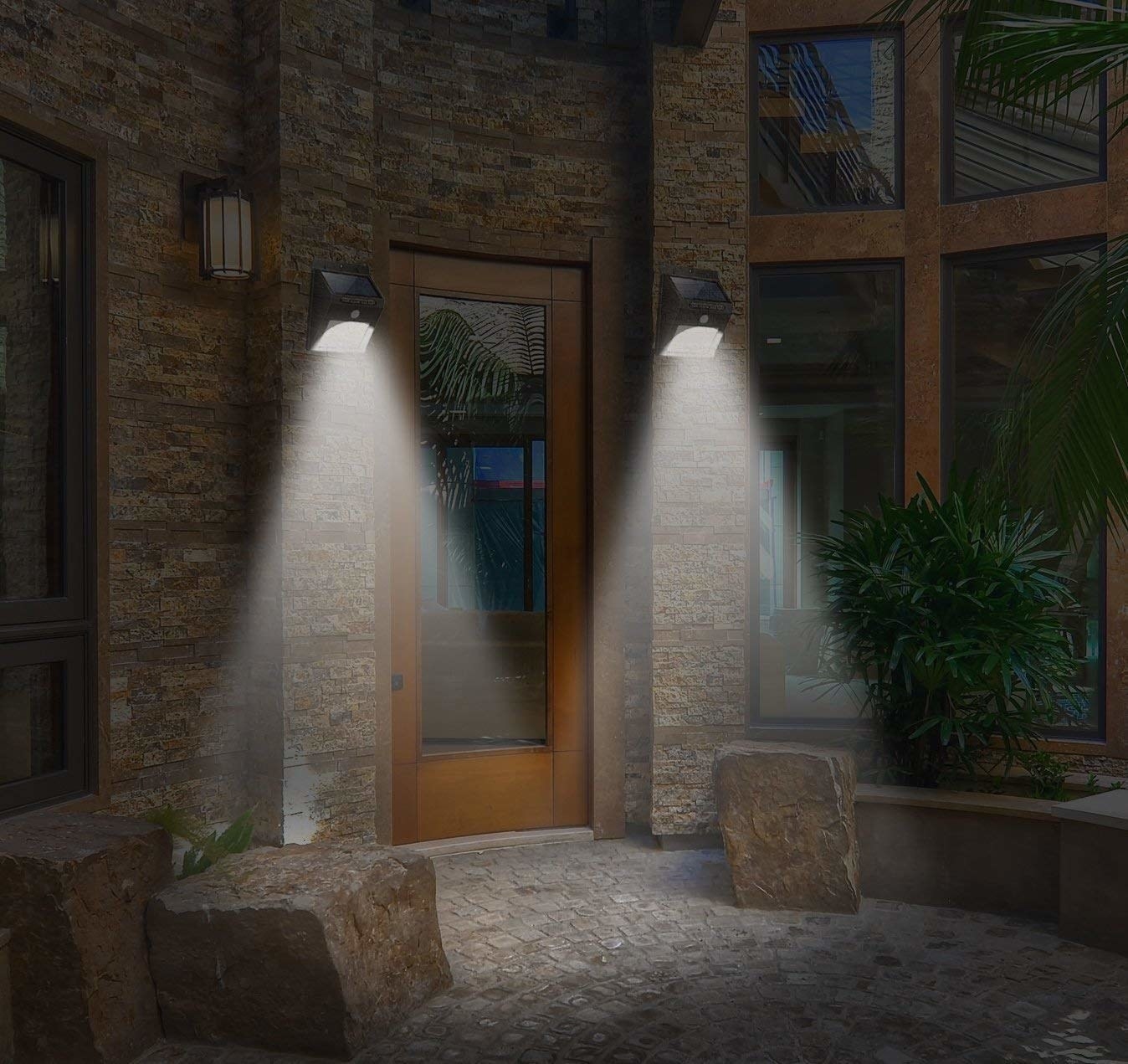 Two flood lights on in front of entrance