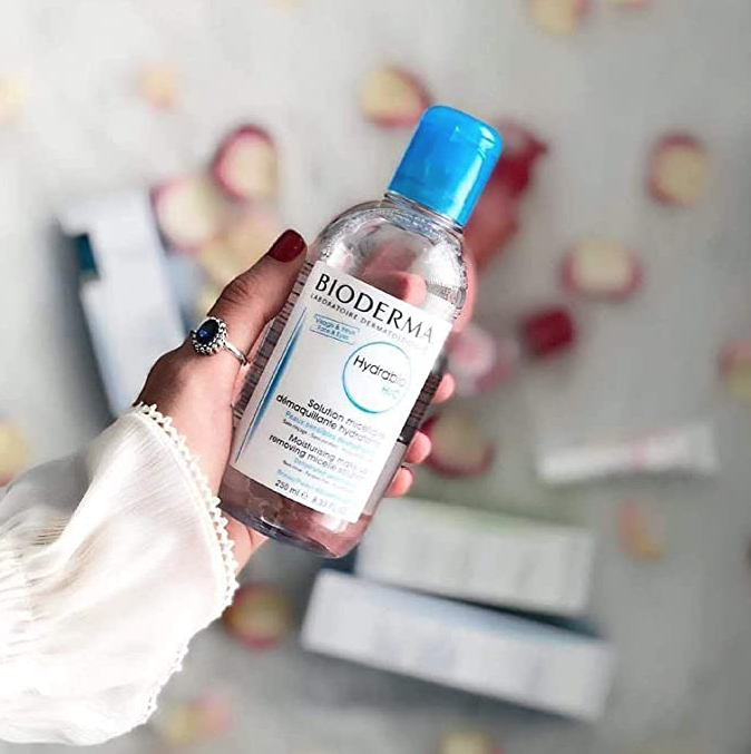 A hand holding the Bioderma Hydrabio H20 Micellar Water