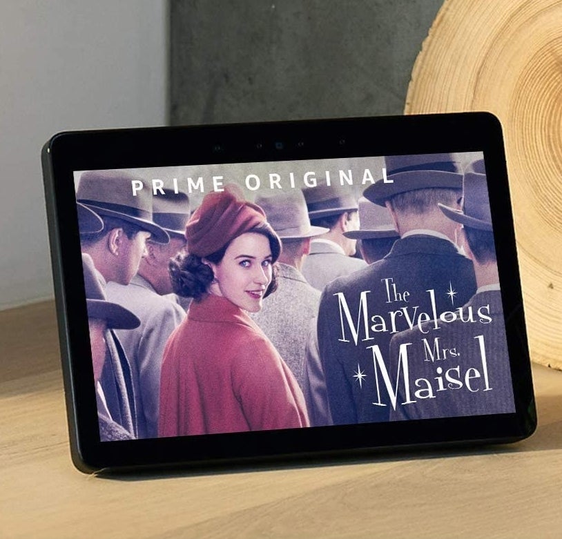 A person watching a show on the Echo Show