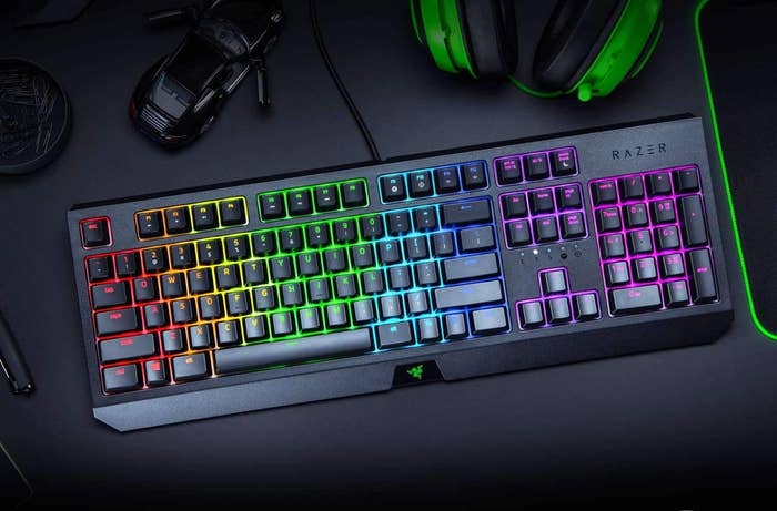 A light-up gaming keyboard on a desk