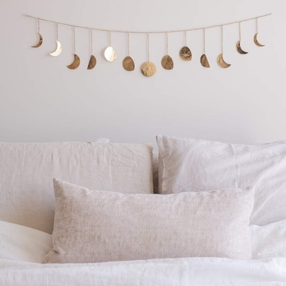 Metal garland with moon phase details