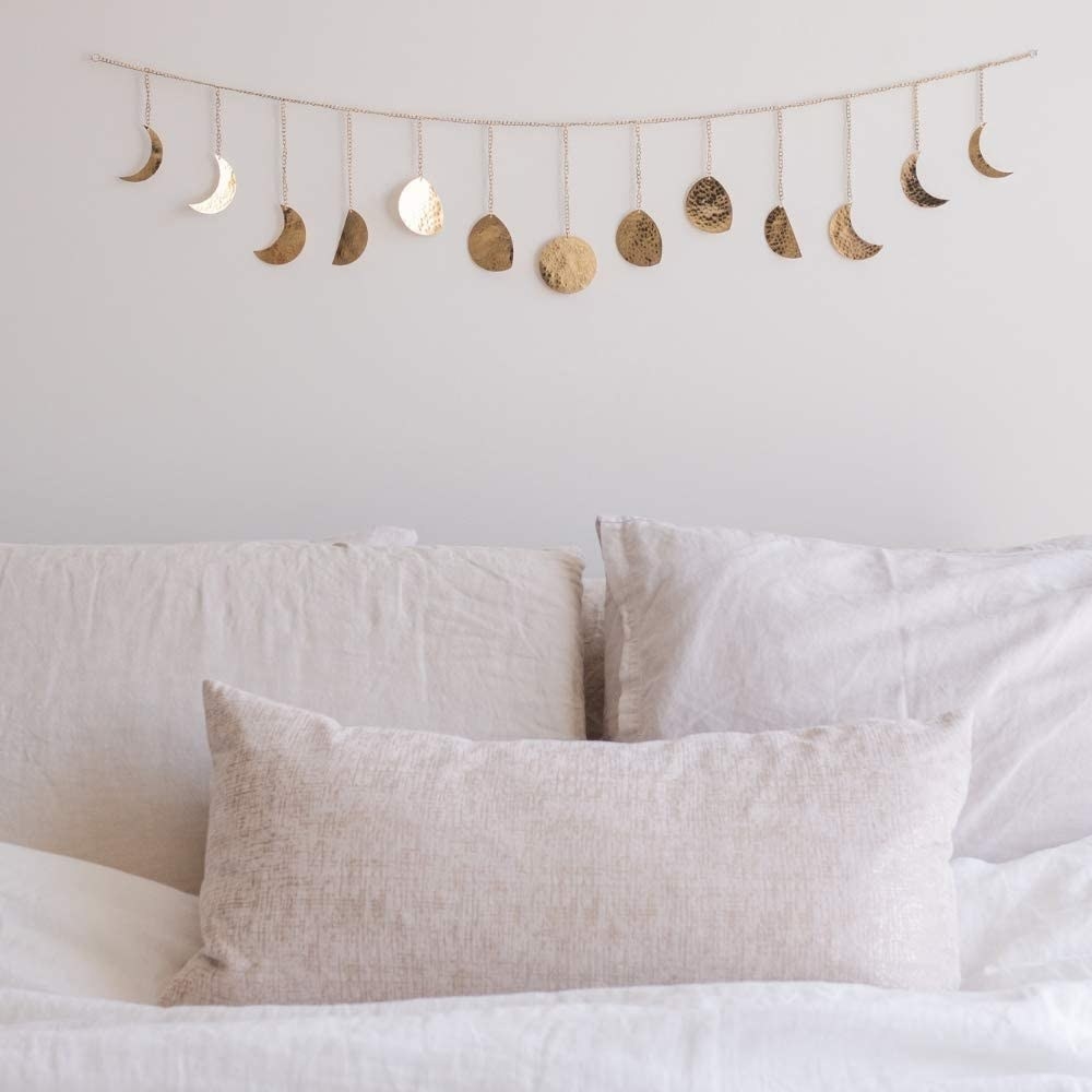 Metal garland with moon phase details 