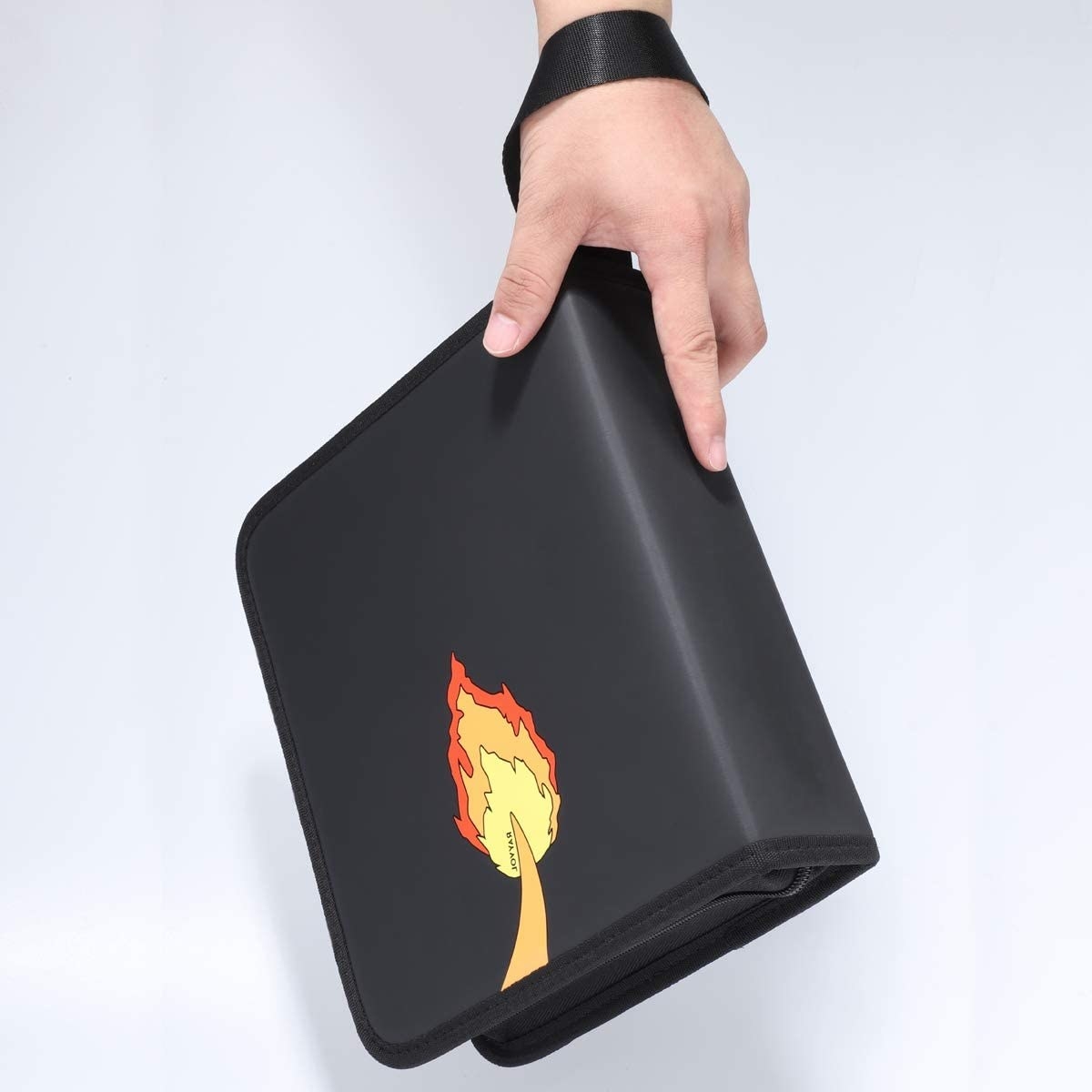 a black matte binder with a charmander tail on it
