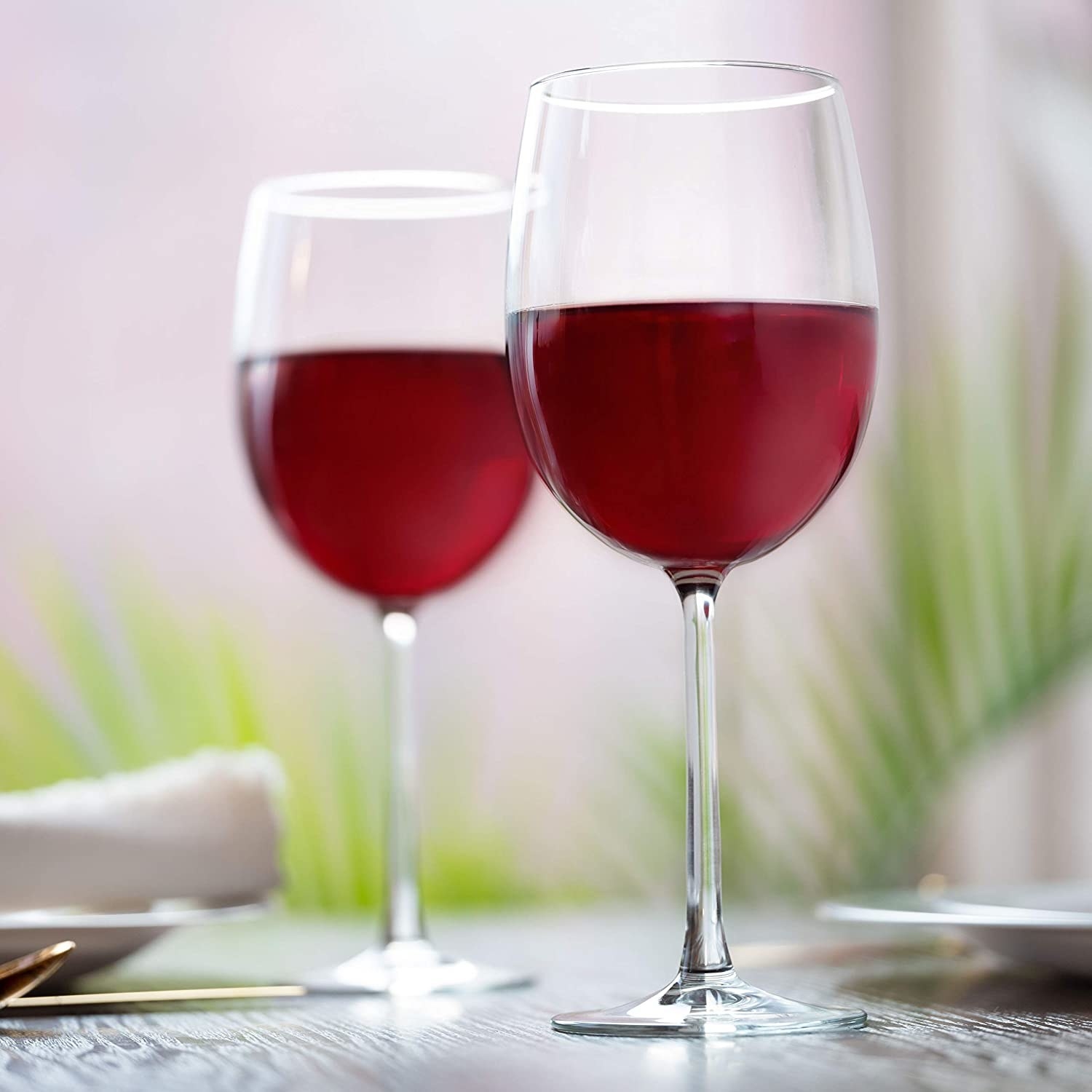 Two wine glasses filled with red wine