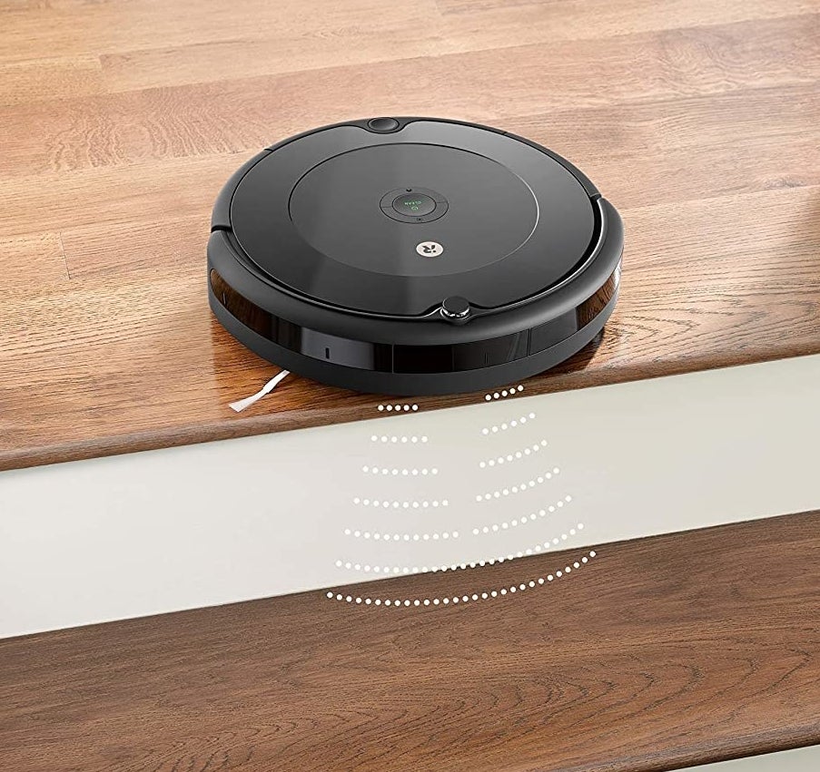 The robot vacuum at the top of a staircase